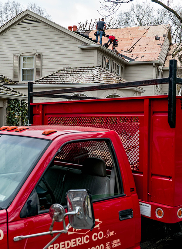Frederic roofing employee replacing a roof